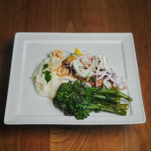 Herbed tomato and cucumbers, lemon, citrus butter, with creamy cauliflower puree and crispy broccolini