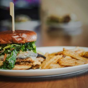 Fried or grilled seasoned chicken breast, spicy pepper jack cheese, cabbage poblano slaw, honey mustard, served on a potato bun