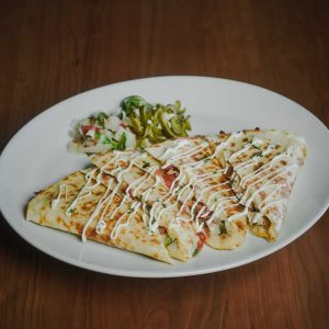 Fresh tortilla, grilled chicken, Mexican cheese, pico de gallo. Substitute brisket or Cajun shrimp